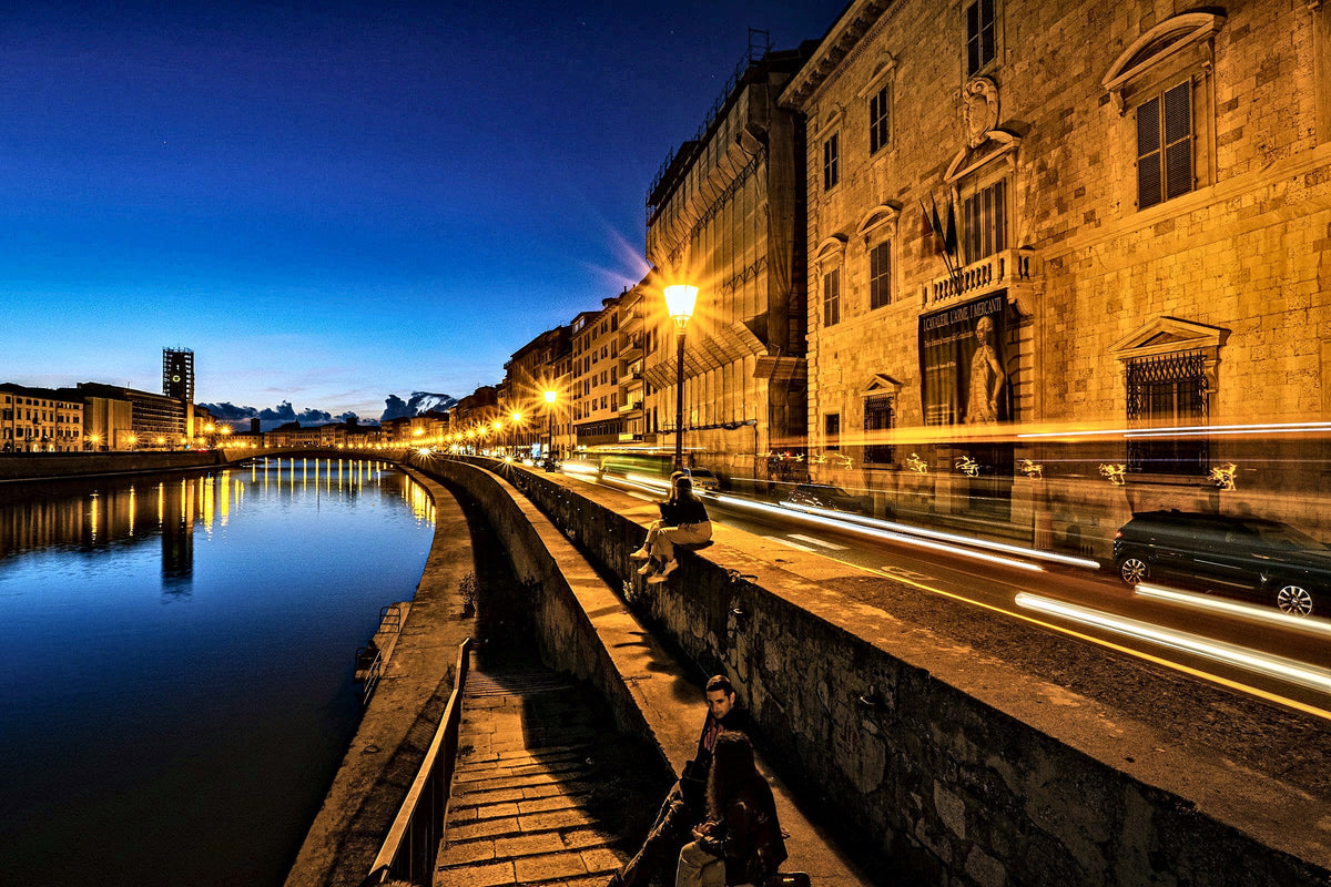 Blue hour on the Lungarno, a passer-by on the river steps