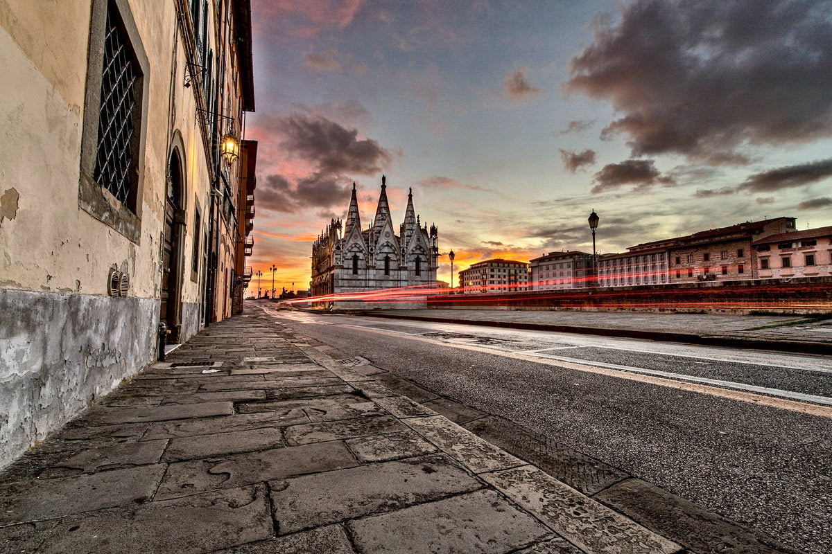 Sunset over the Lungarno and the Gothic pinnacles of Santa Maria della Spina
