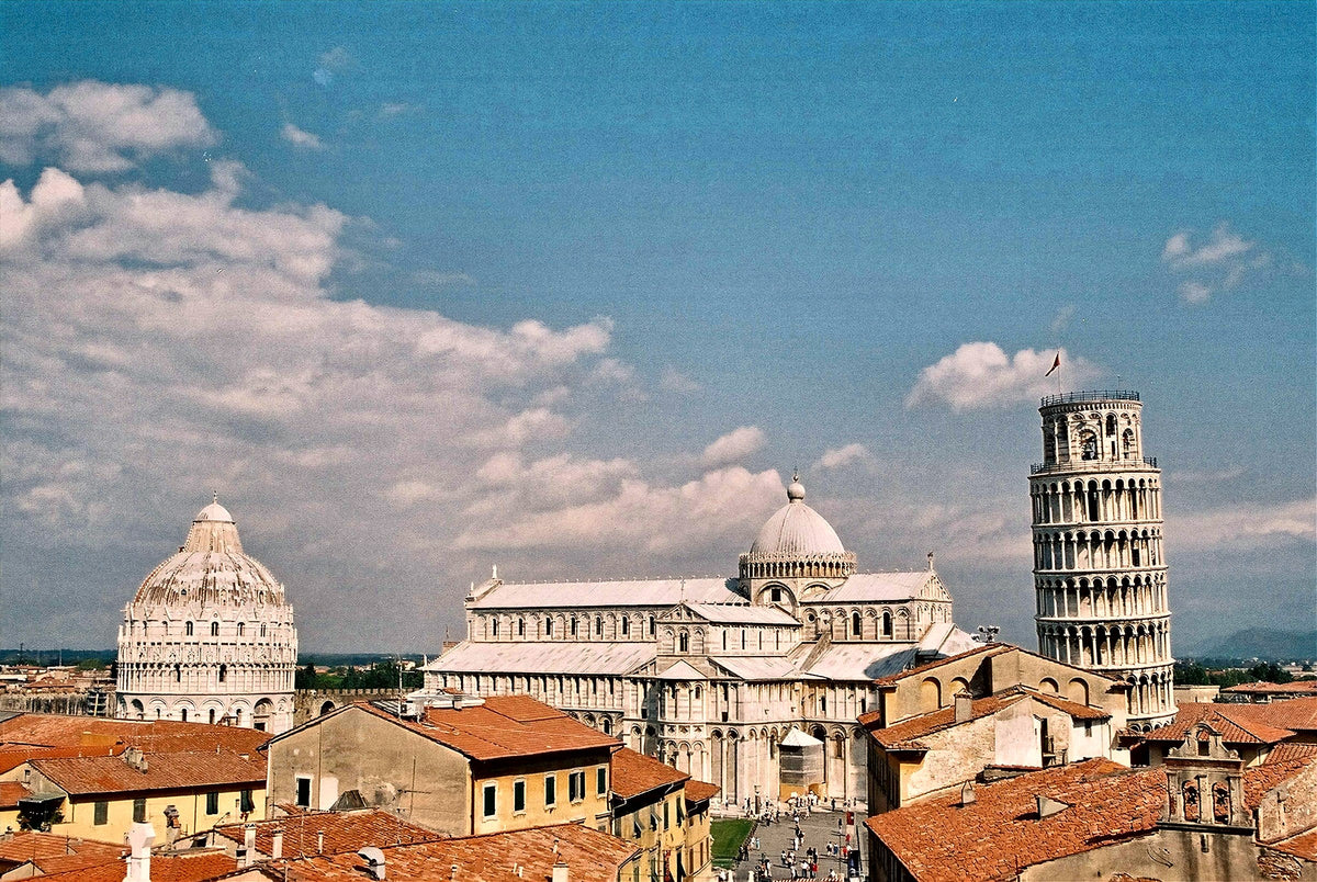 Piazza dei Miracoli rising above the red roofs of the city