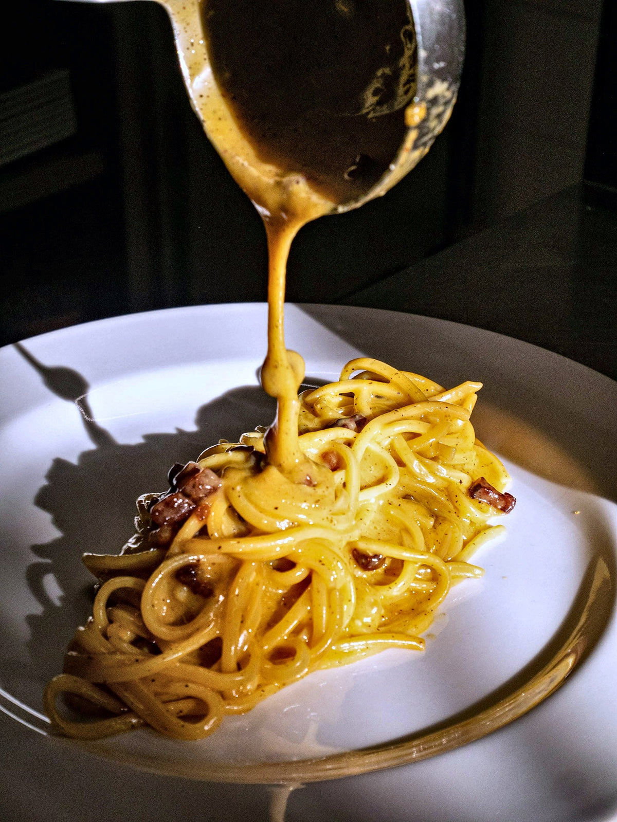 Carbonara finished at the table at Grano Libero