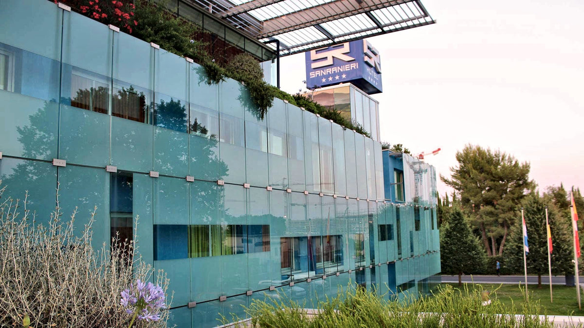The glass facade of San Ranieri Hotel