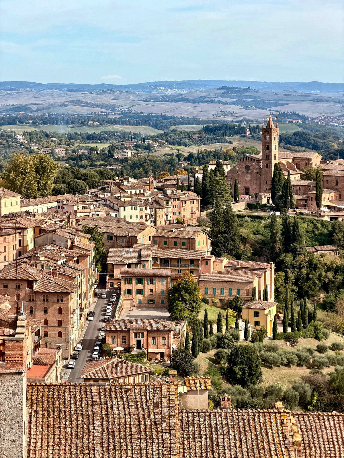 Rooftops tumbling down to the Tuscan hills