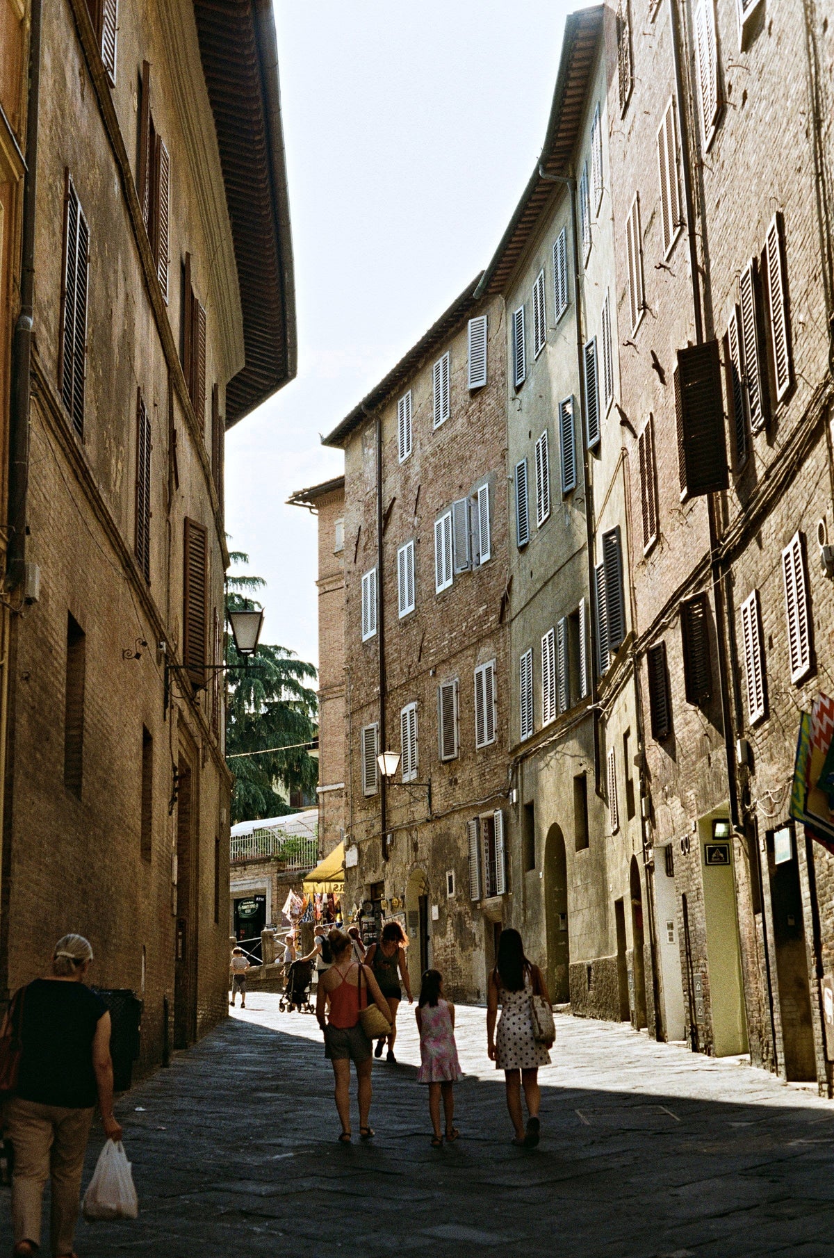 A family walk down a medieval street
