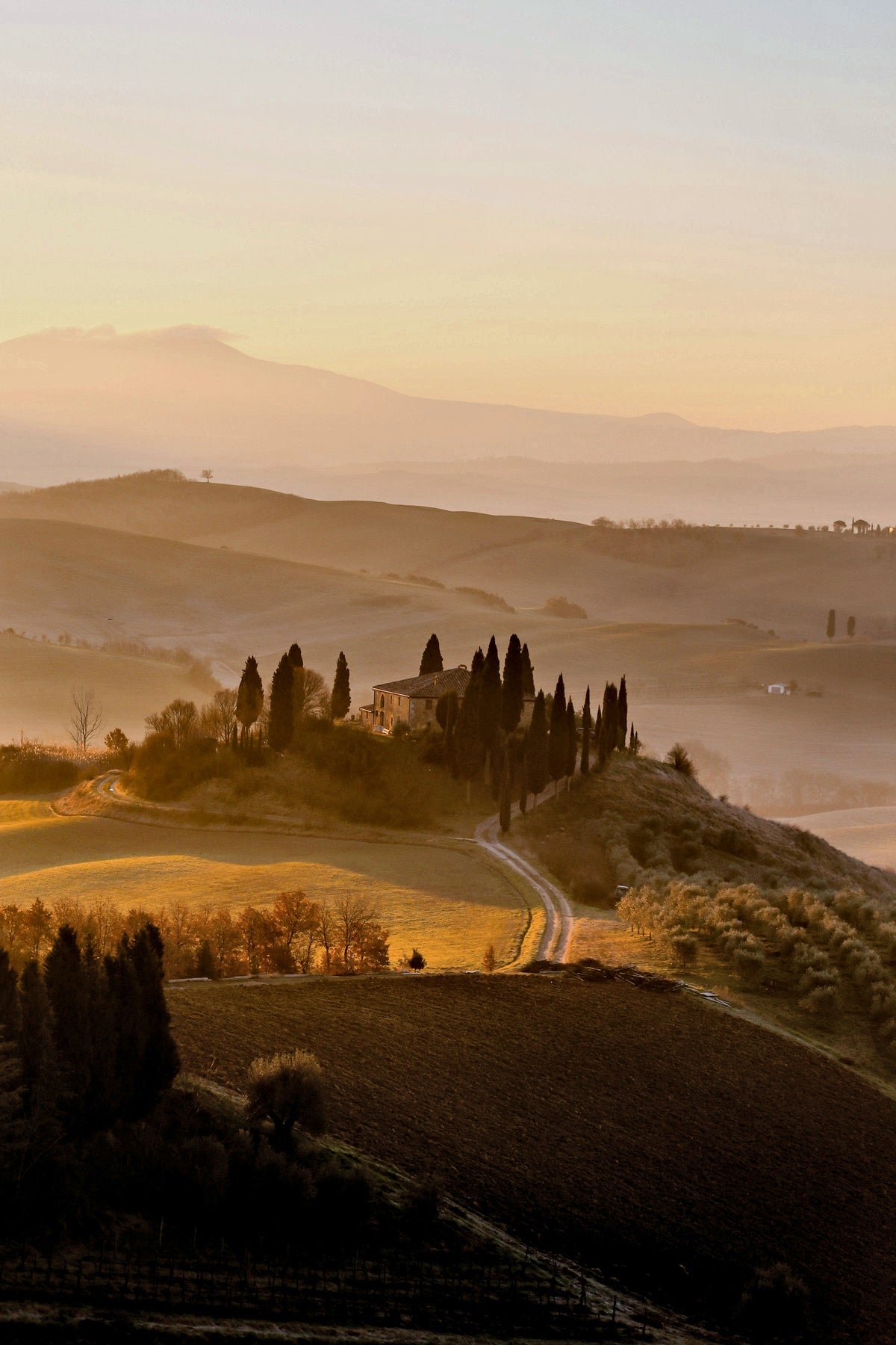Sunrise mist over the hills of San Quirico d’Orcia