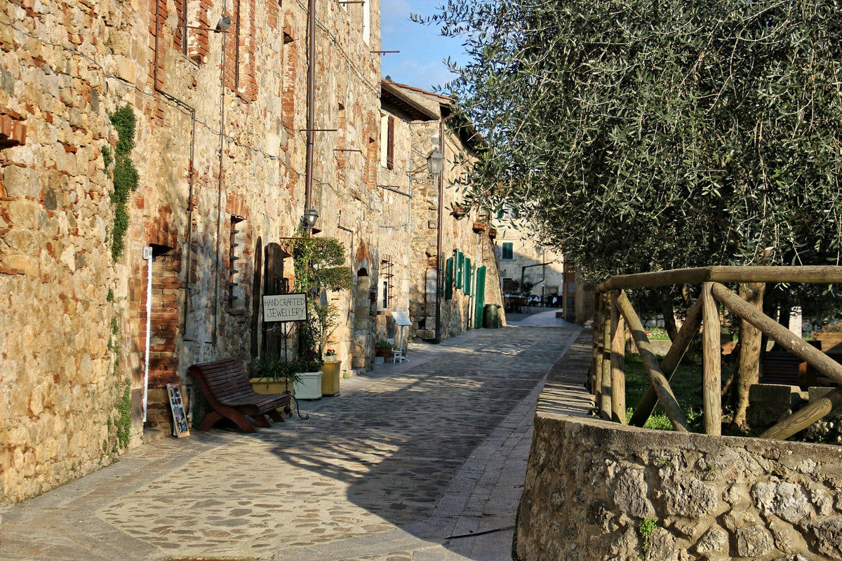 A quiet stone street inside Monteriggioni