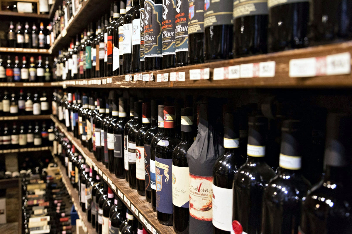 Brunello bottles lining a Montalcino wine shop