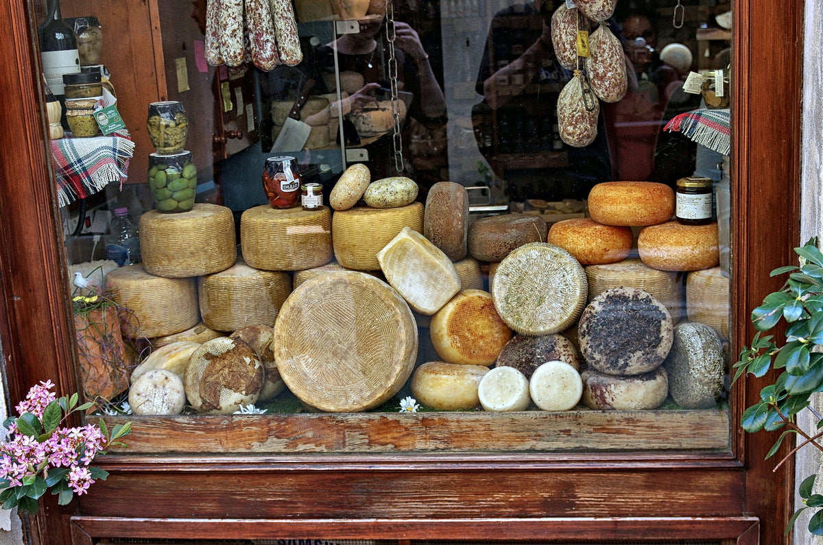Wheels of pecorino in a Pienza shop window