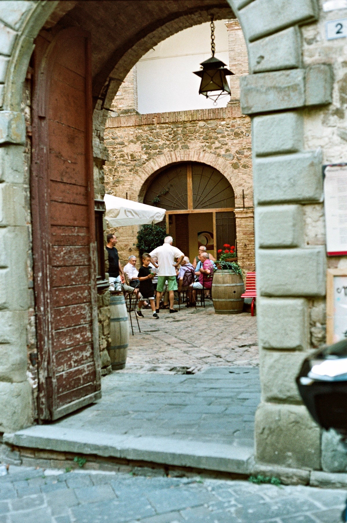 A courtyard wine bar beside the barrels
