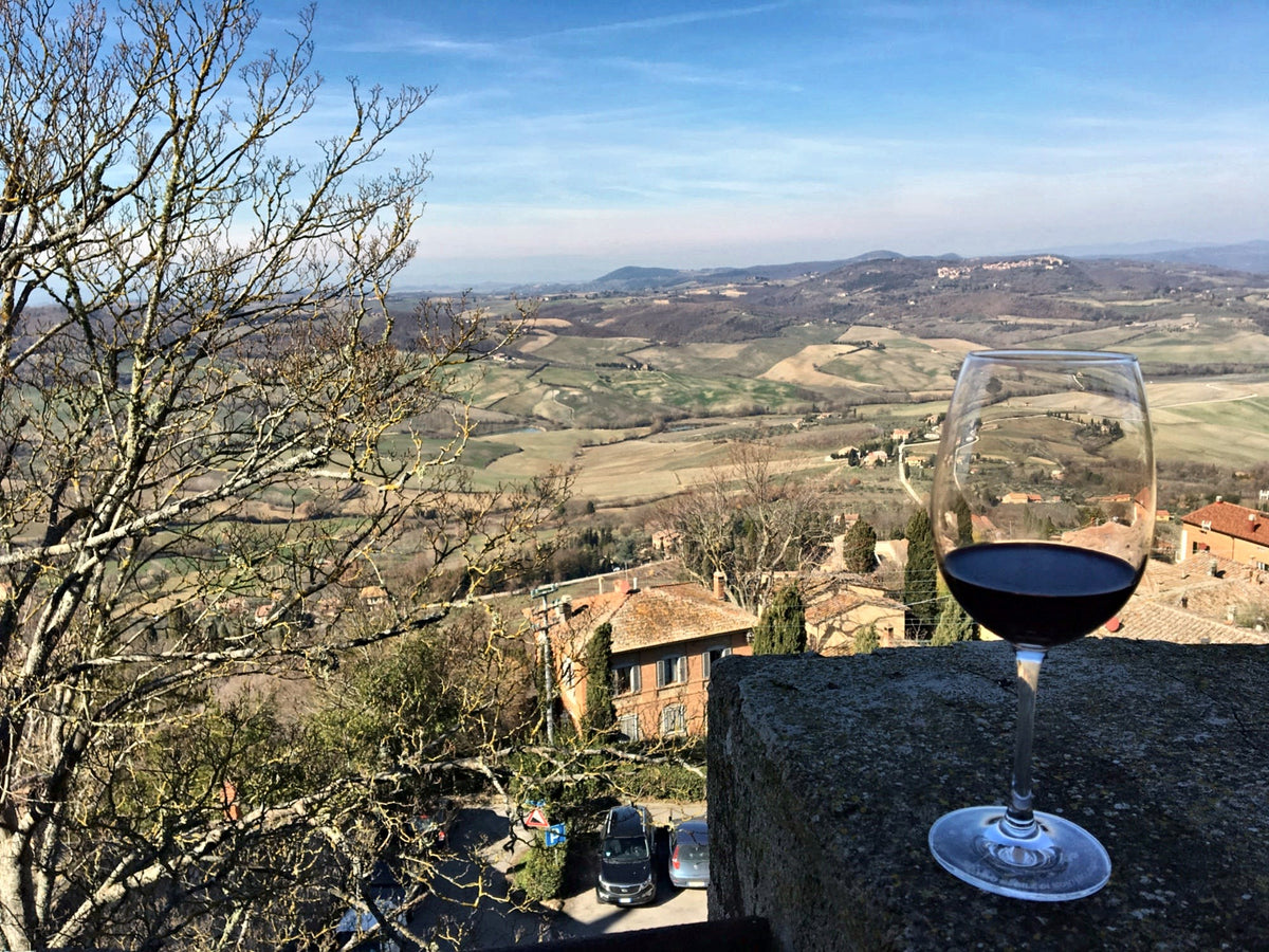 A glass of Vino Nobile di Montepulciano with a view