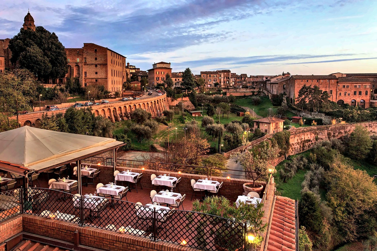 Panoramic terrace restaurant above the rooftops at sunset, Hotel Athena