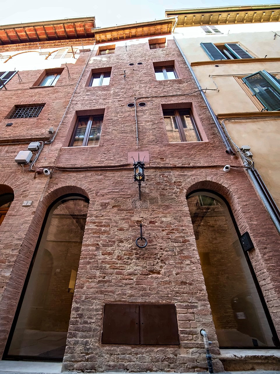 The brick facade of the sixteenth-century tower house of Torre del Fuggisole