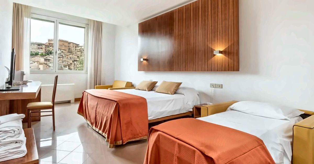Twin room with a view of the old town at Hotel Minerva