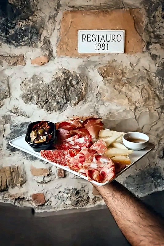 Board of Tuscan cured meats and cheese at Antica Trattoria Botteganova
