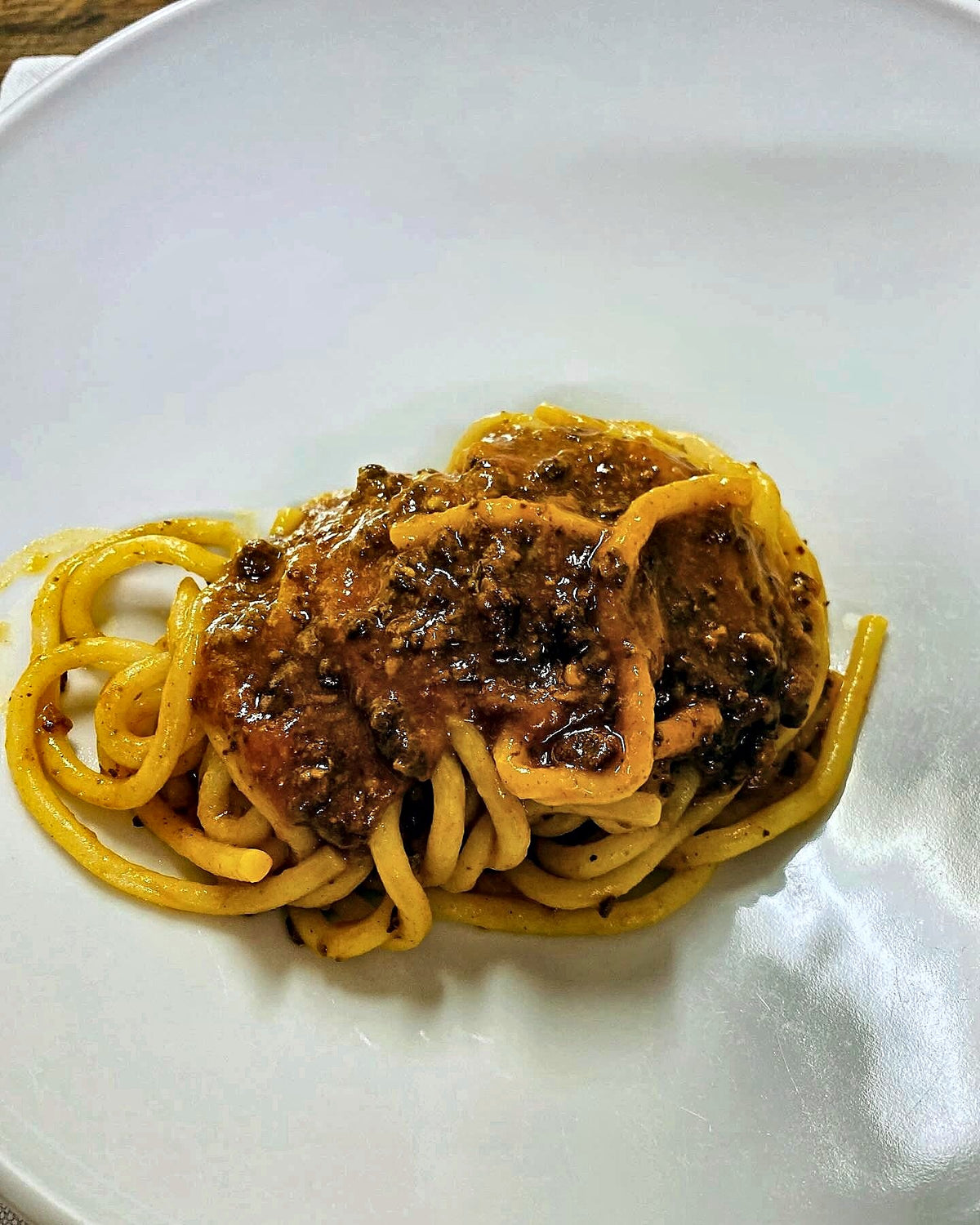 Pici with meat ragù at Enoteca I Terzi