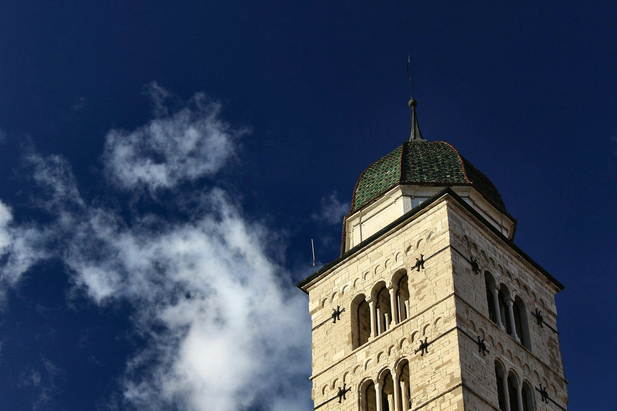 Bell tower against a deep blue sky