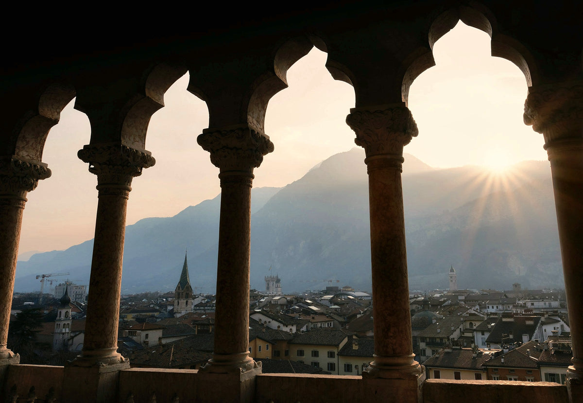 Sunset through the Gothic arches of Buonconsiglio Castle
