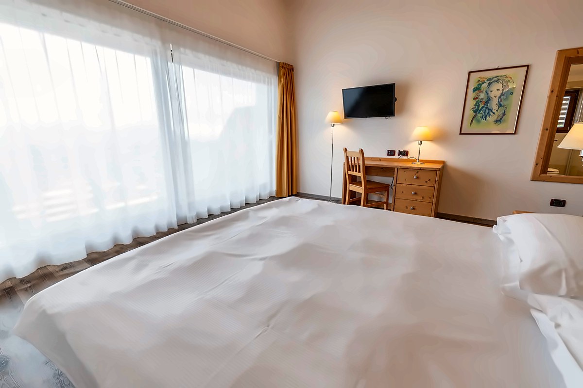 Bright double room at Chalet Caminetto