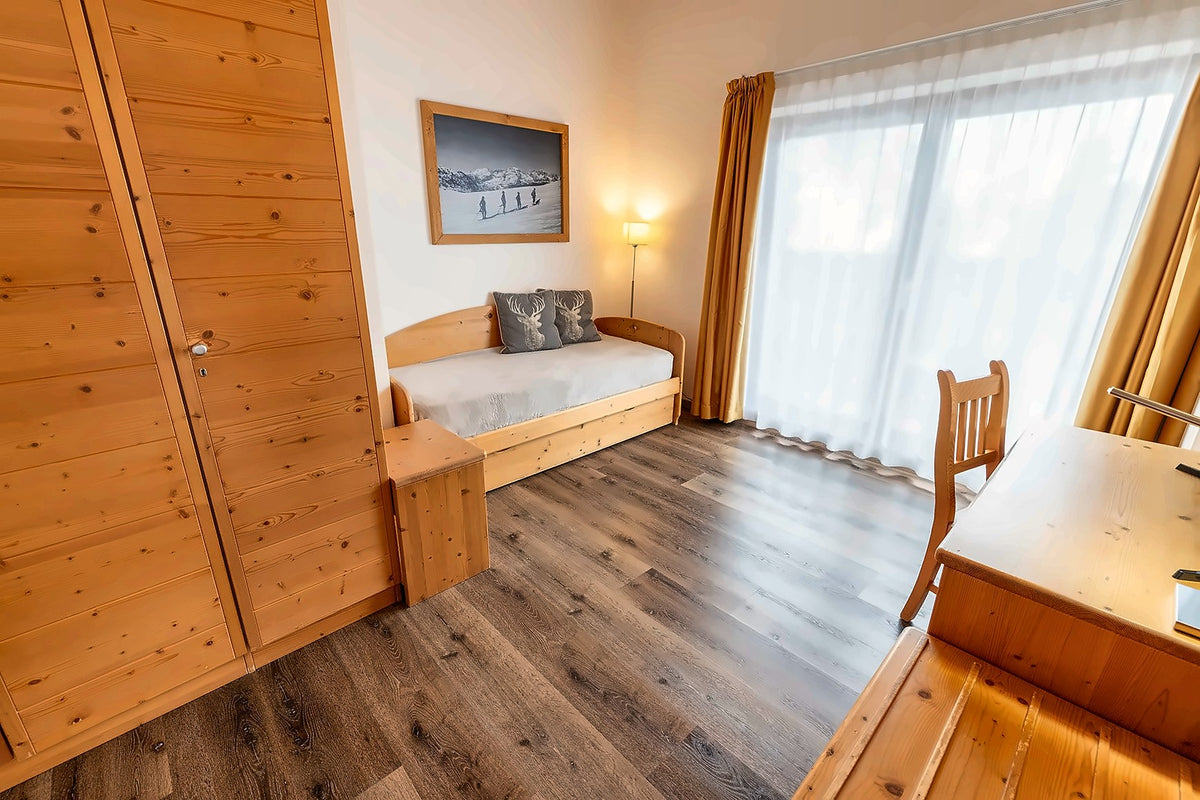 Pine-panelled room at Chalet Caminetto on Monte Bondone