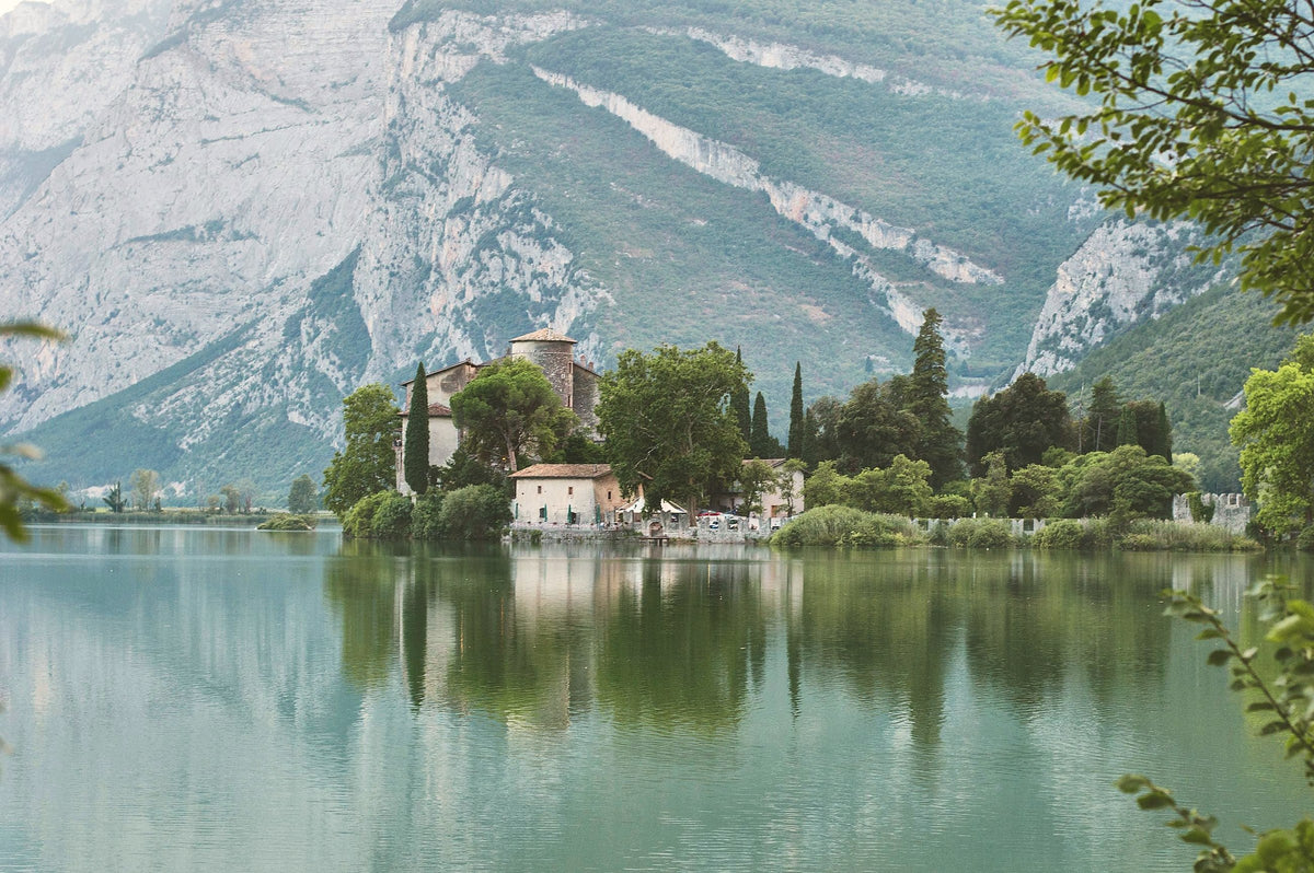 Castel Toblino mirrored in its lake, west of the city