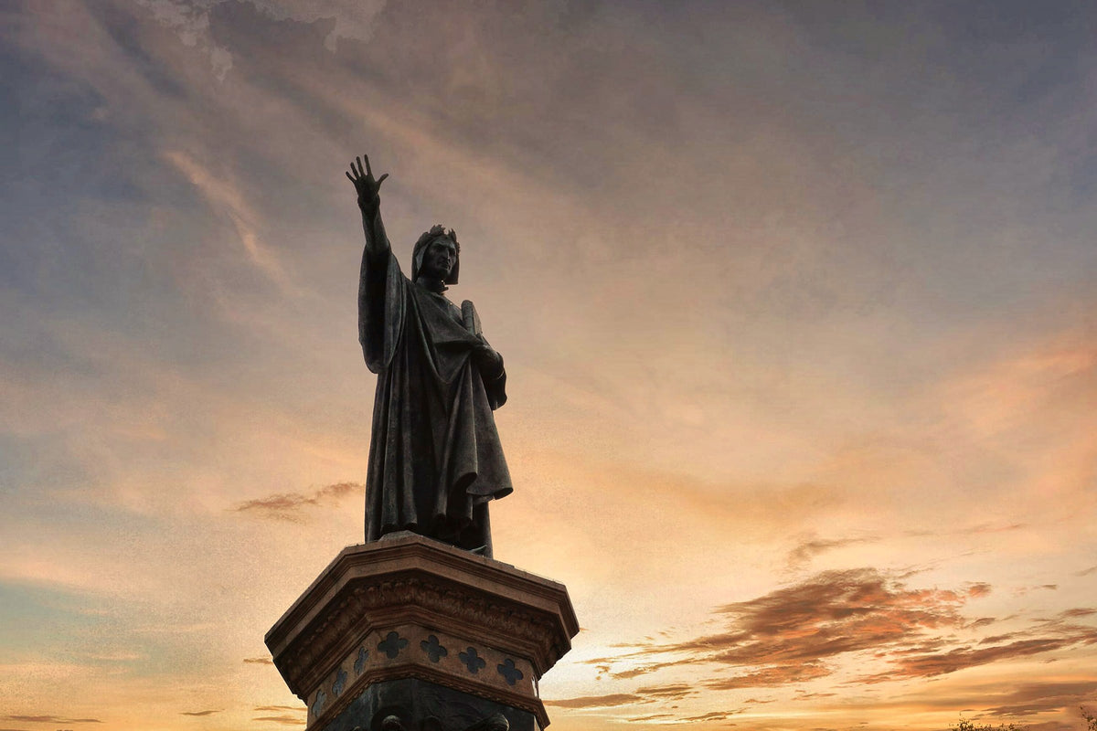The Dante monument silhouetted against a sunset sky