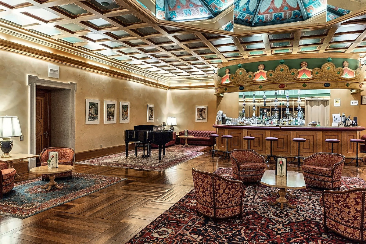 Bar Il Caminetto under the coffered ceiling of Grand Hotel Trento