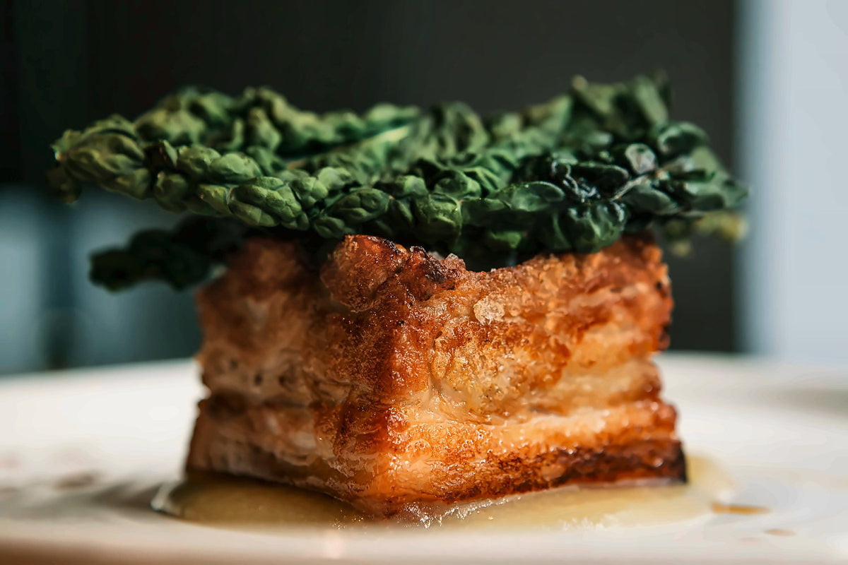 Crisp layered dish topped with kale at La Maison de Filip
