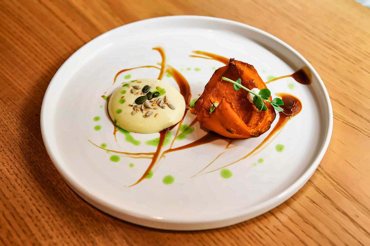 Plated dish with sauces at La Maison de Filip