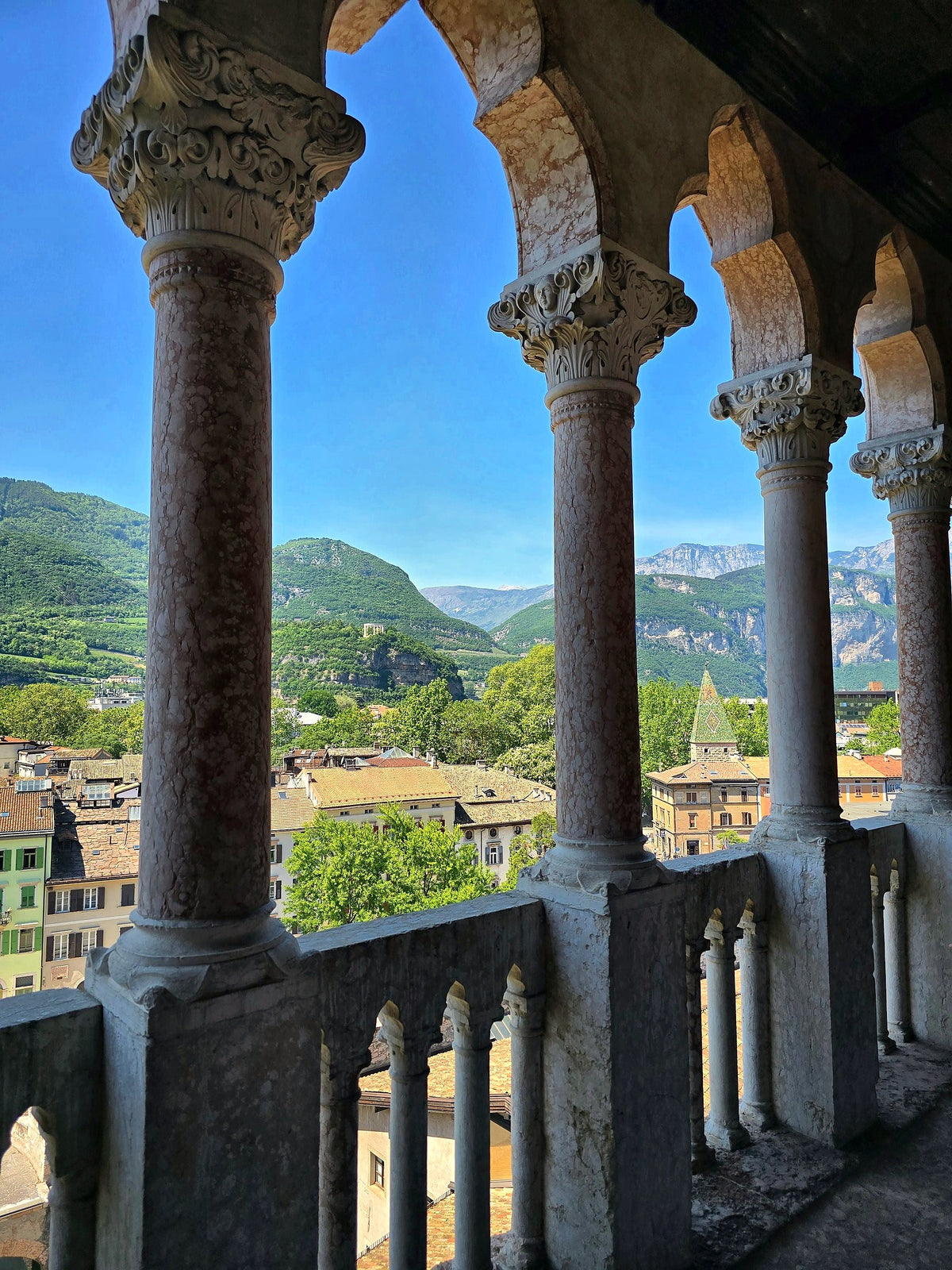 Stone columns framing the city and the mountains