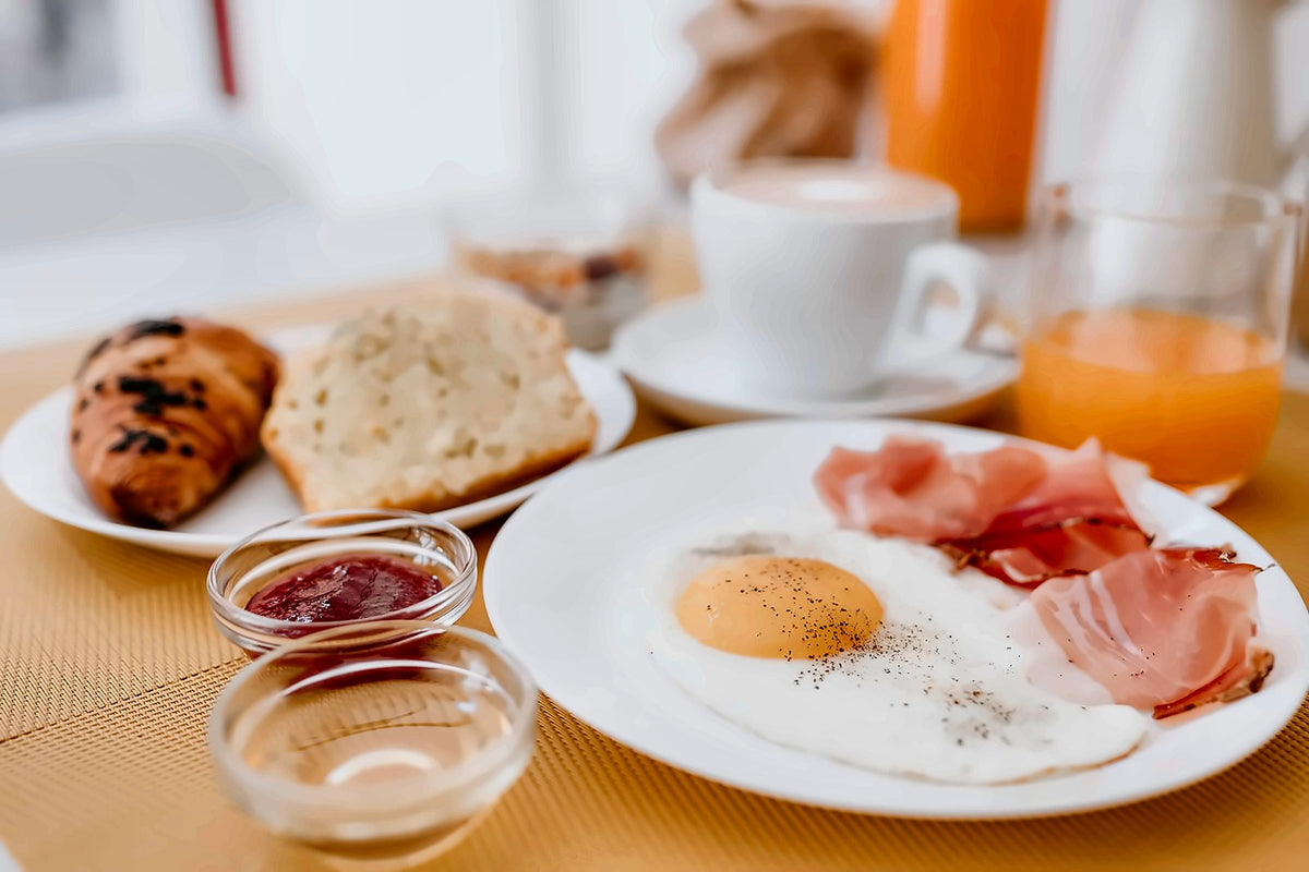 Breakfast with eggs, ham and fresh juice at Hotel Venezia