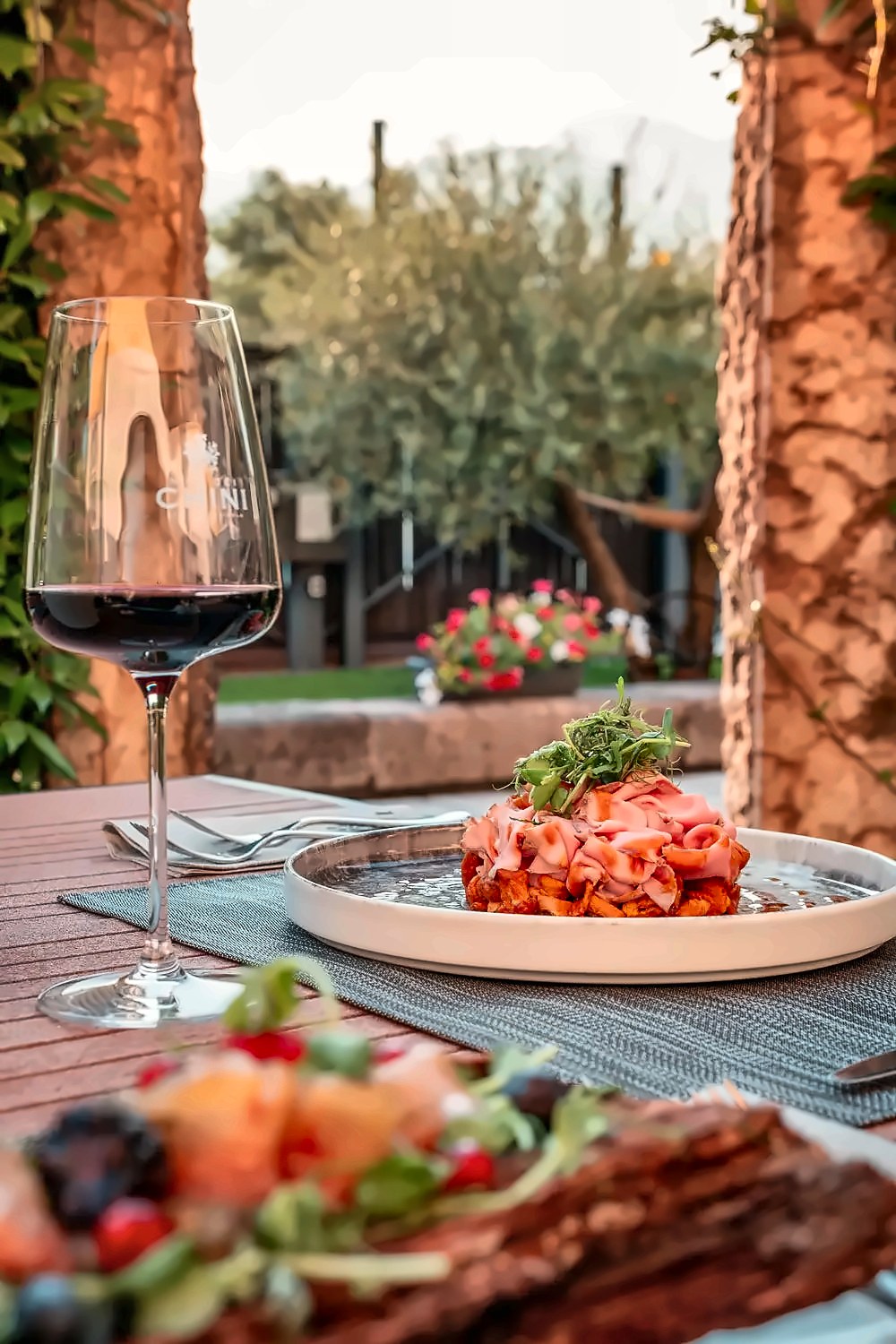 Garden table with Teroldego at La Vigneria, Mas dei Chini