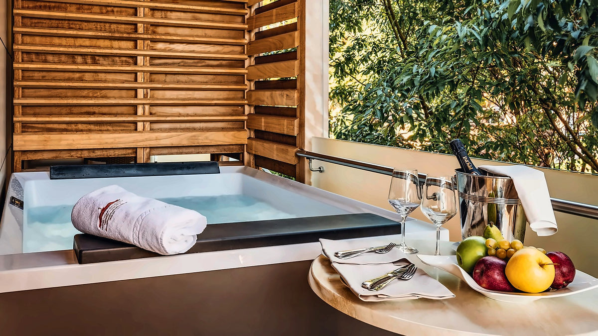 Belvedere room terrace with a private hot tub at Villa Madruzzo
