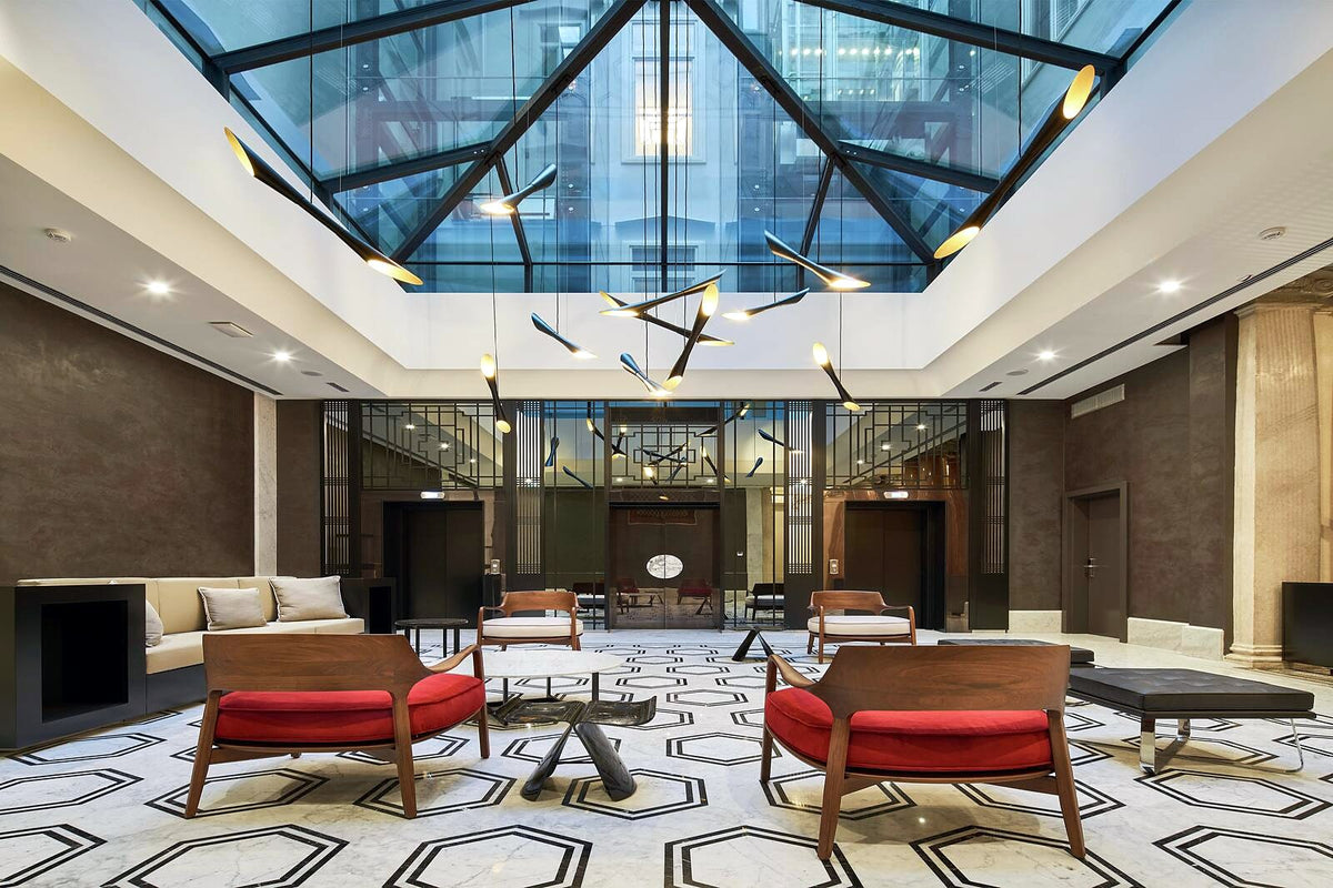 Glass-roofed lobby at DoubleTree by Hilton Trieste