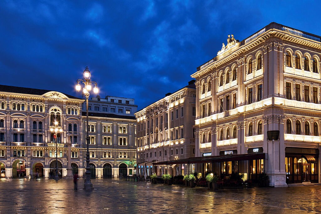 Grand Hotel Duchi d'Aosta on Piazza Unità at night