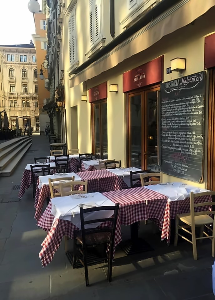 Outdoor tables on Via Malcanton at Hostaria Malcanton