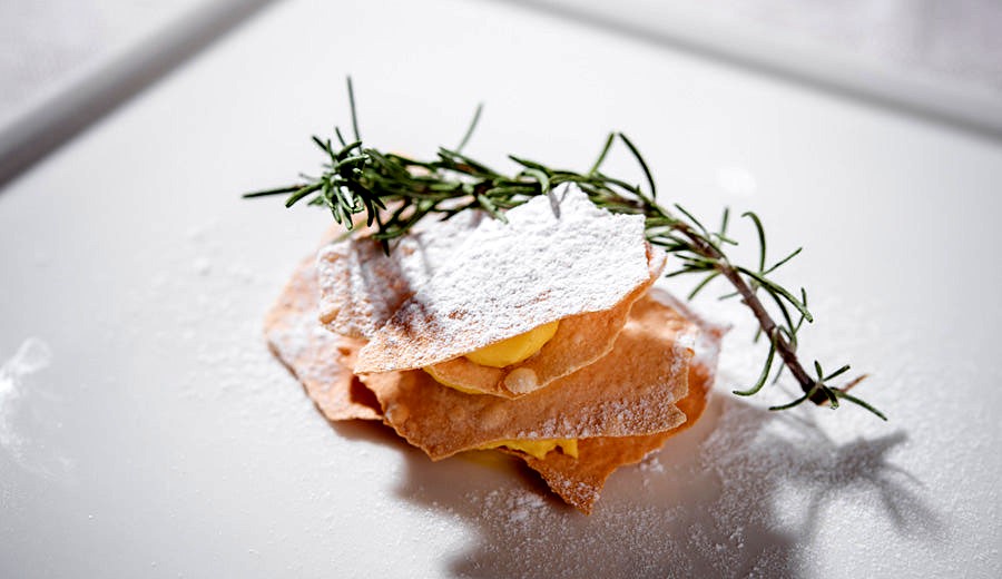 Plated dish with rosemary at Trattoria Valeria 1904