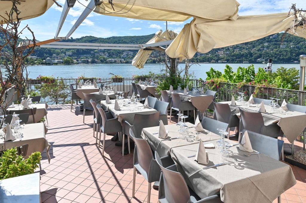 The lakeside dining terrace at Hotel Marco's