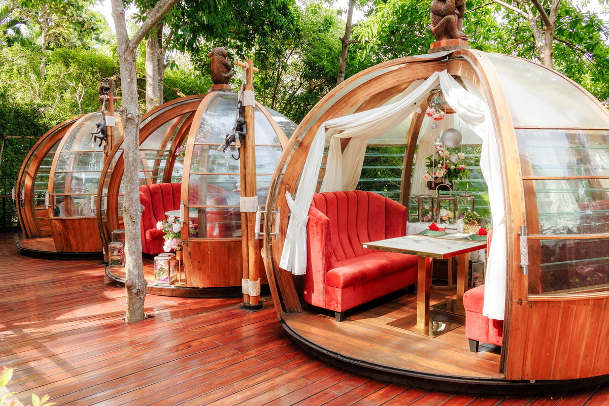 Private glass dining domes in the rainforest at Three Monkeys