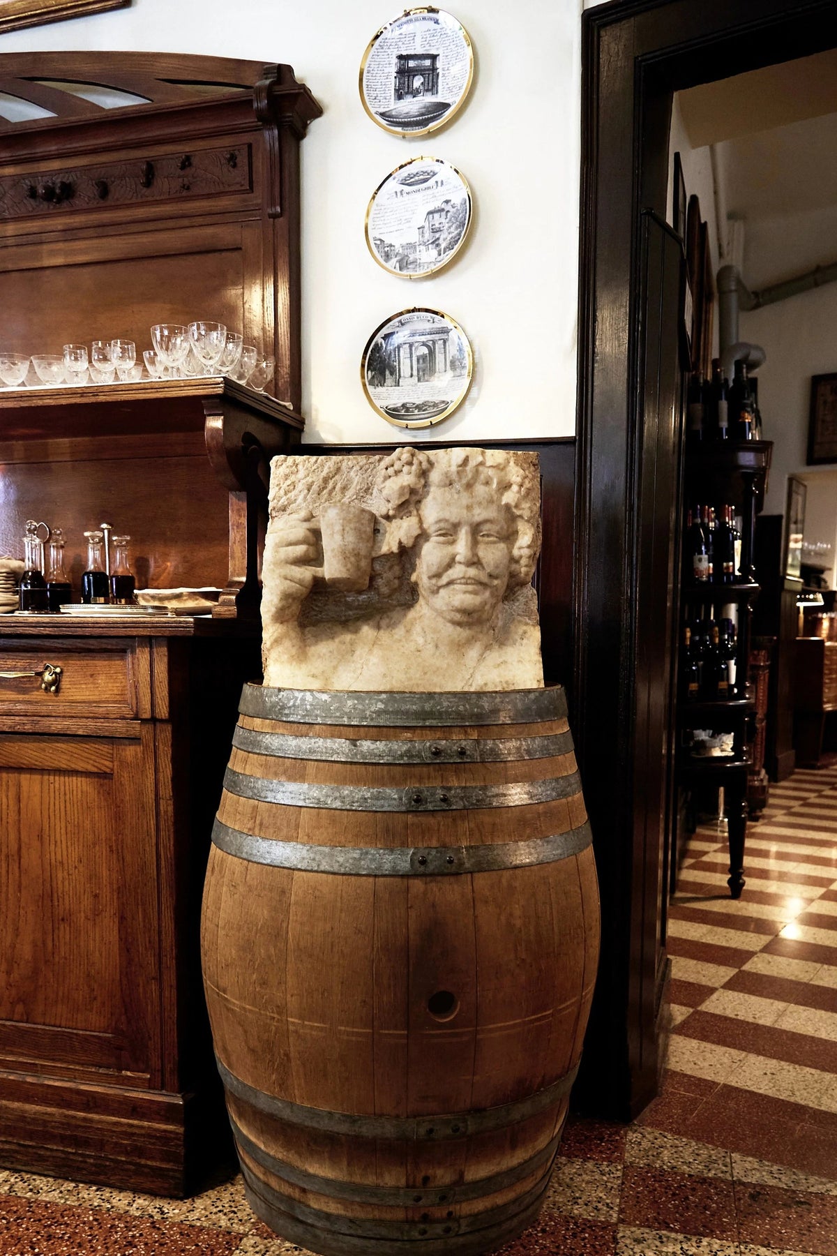 Wood panelling and an old barrel at Antica Trattoria della Pesa