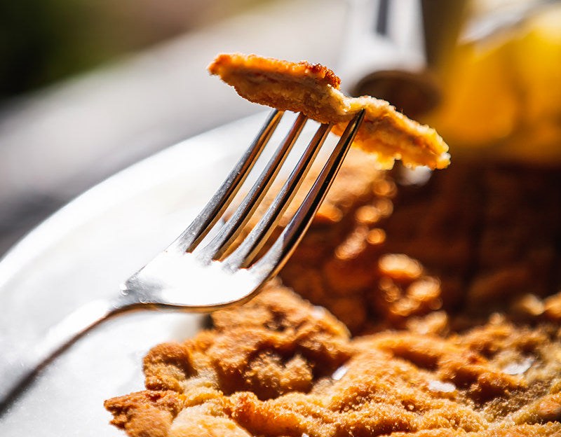 A forkful of cotoletta at El Brellin