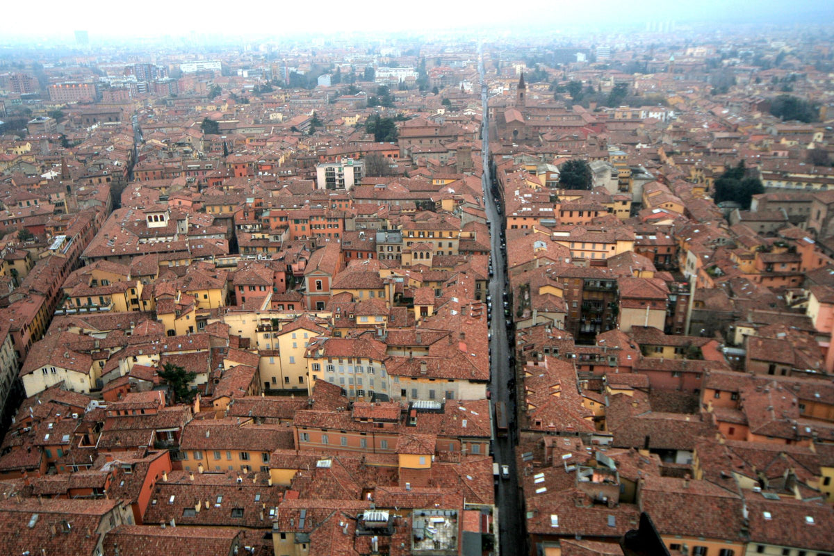 Bologna's historic red rooftops and medieval buildings from above