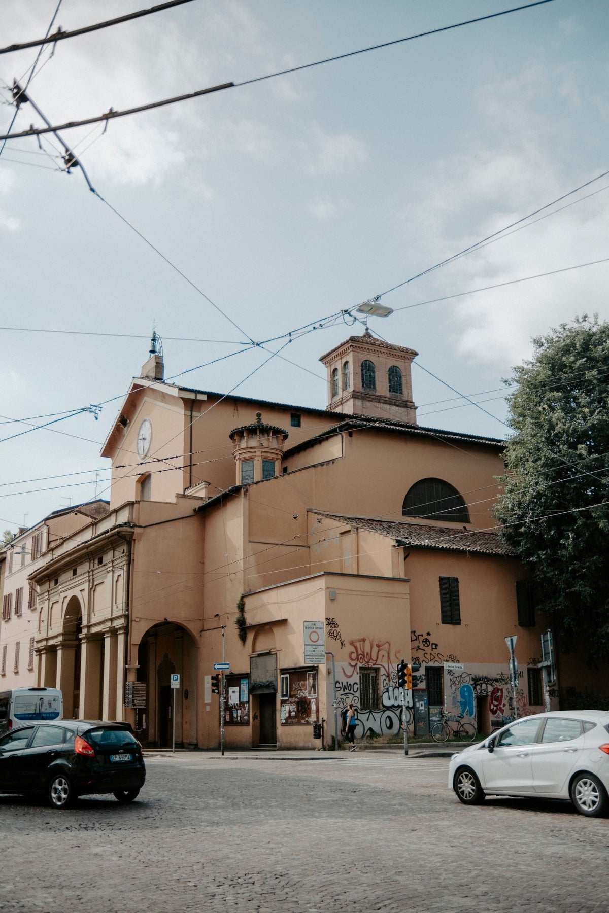 The Church of Santa Maria della Carità on a busy Bologna street