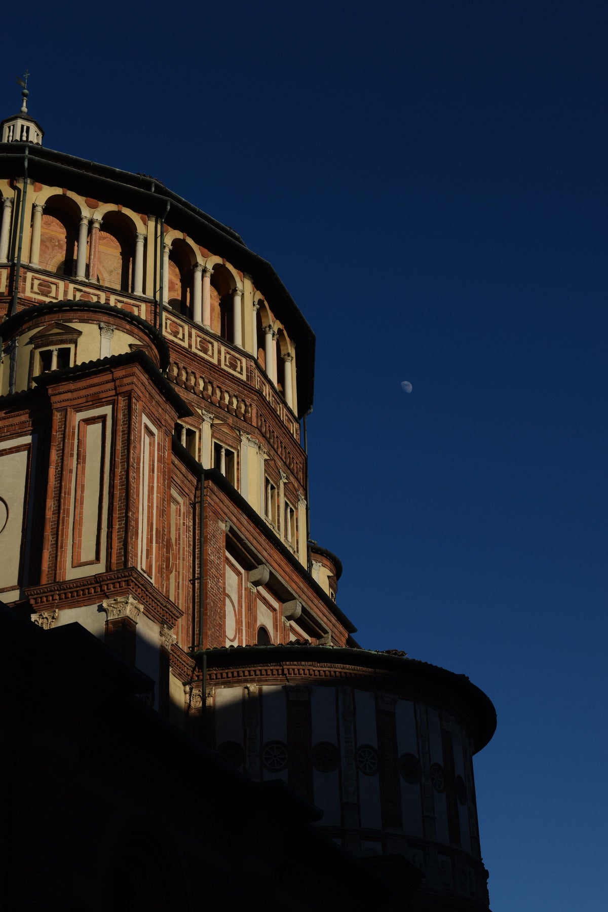 Santa Maria delle Grazie at night under a moonlit sky