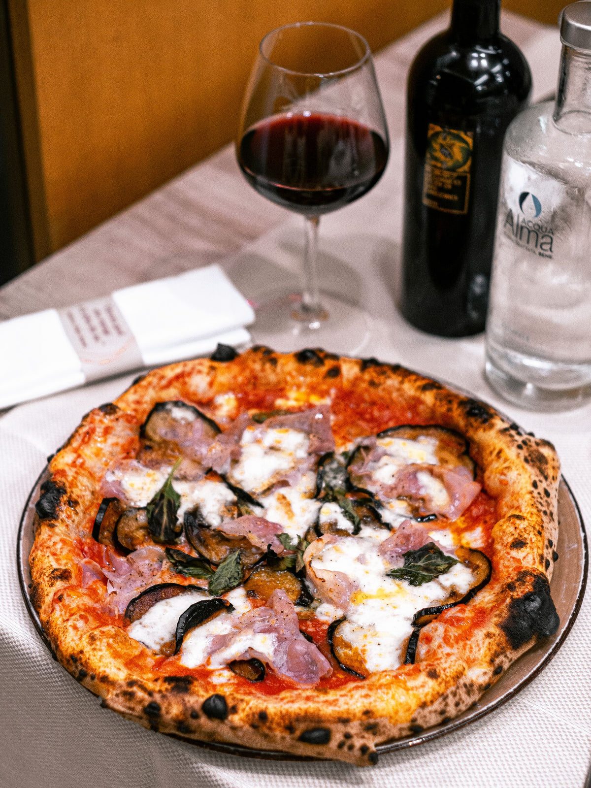 Pizza and red wine at a Naples restaurant