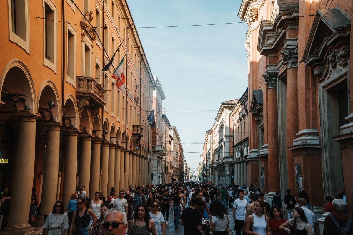 A lively crowd on a street in Bologna