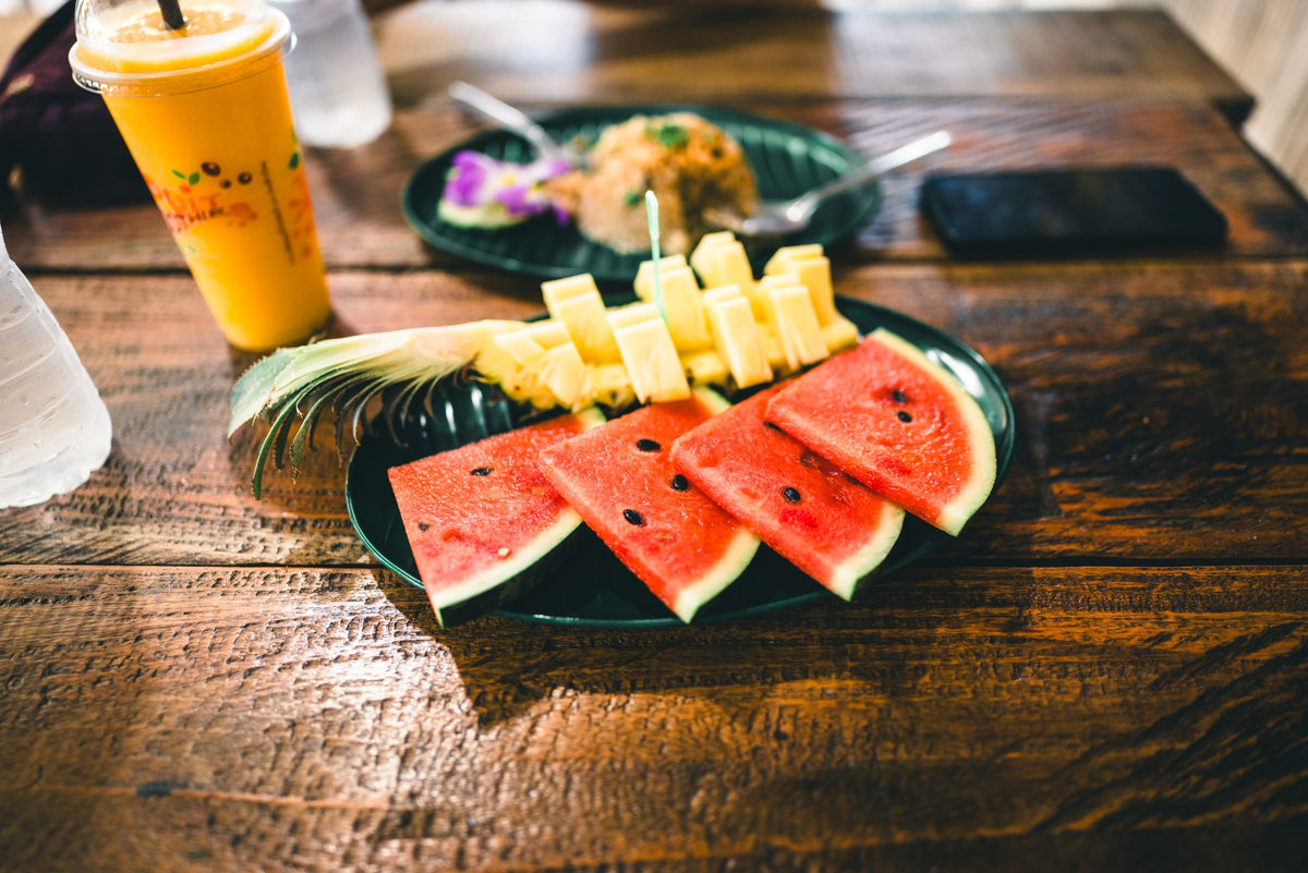 Watermelon and pineapple on a rustic table in Phuket