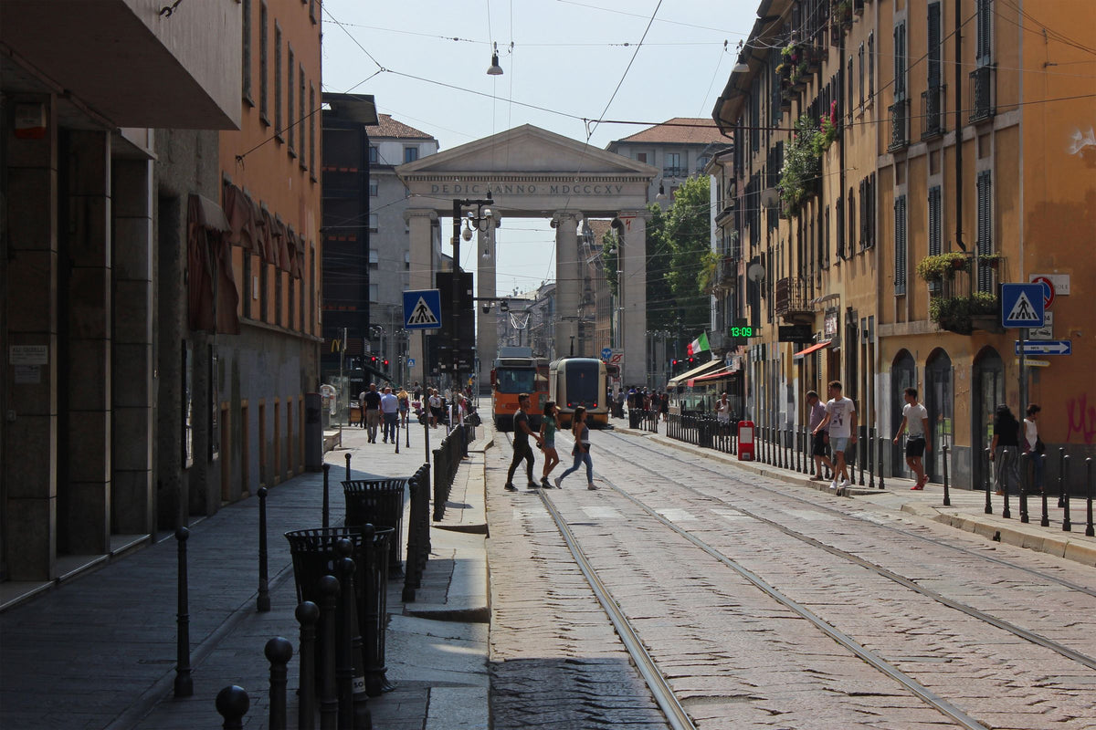 A tram on a sunny street at Porta Ticinese