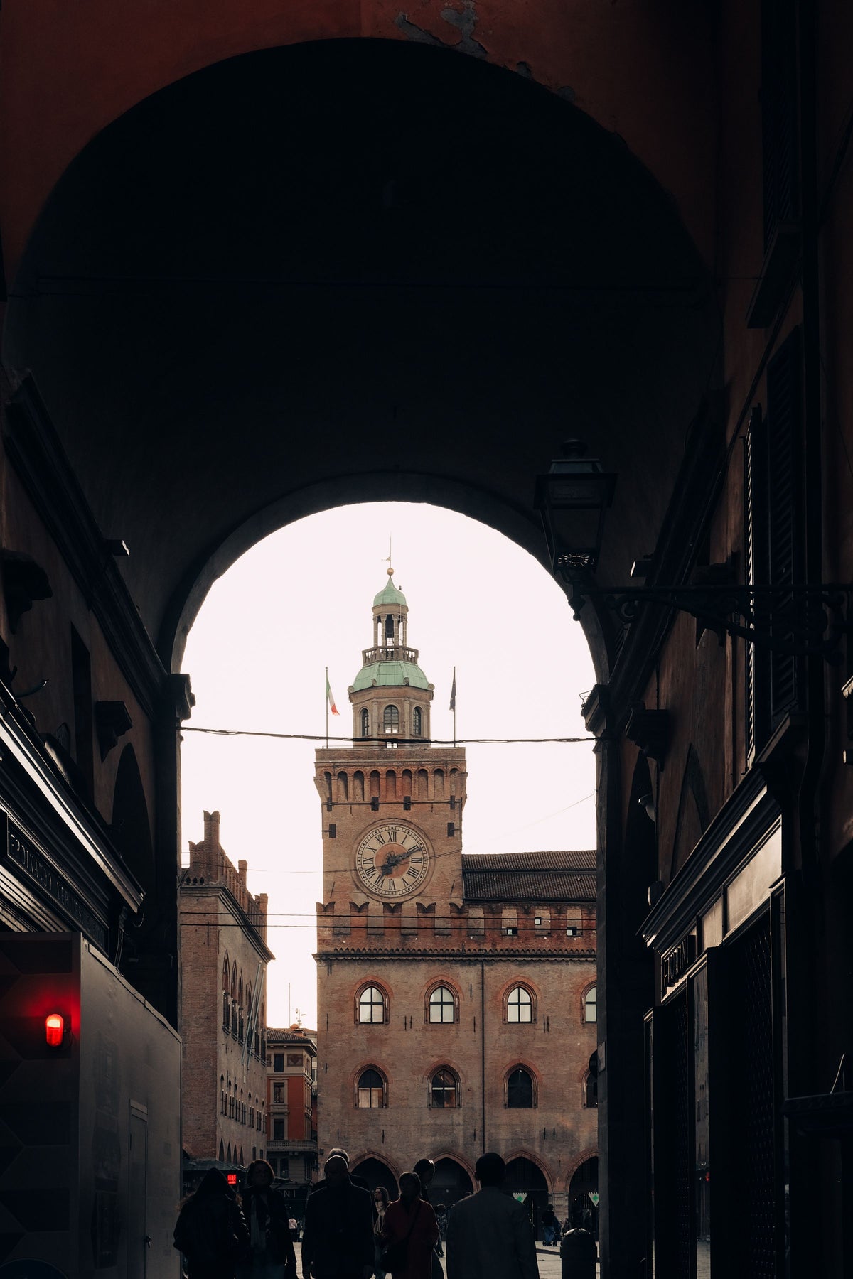 Palazzo del Podestà seen through an archway