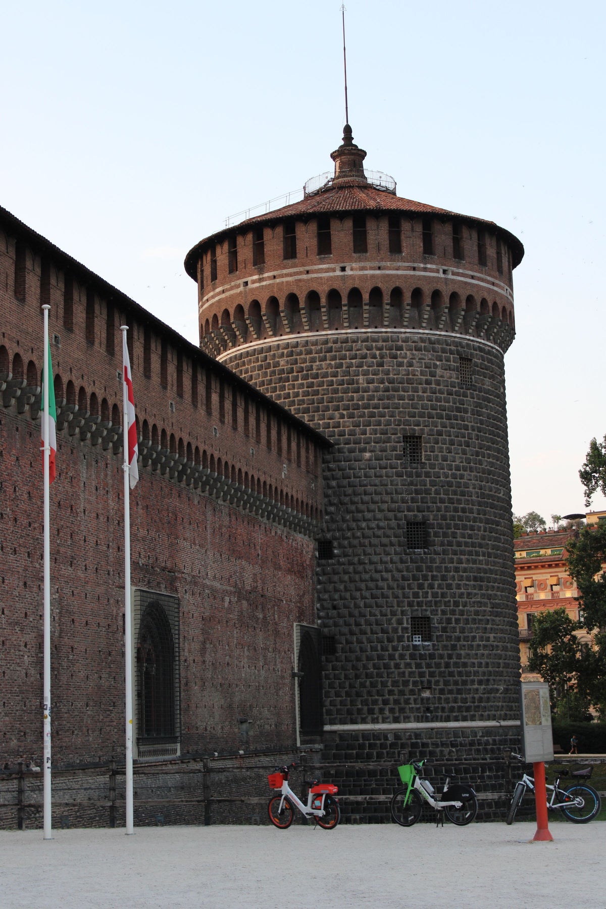 A tower of Castello Sforzesco at sunset