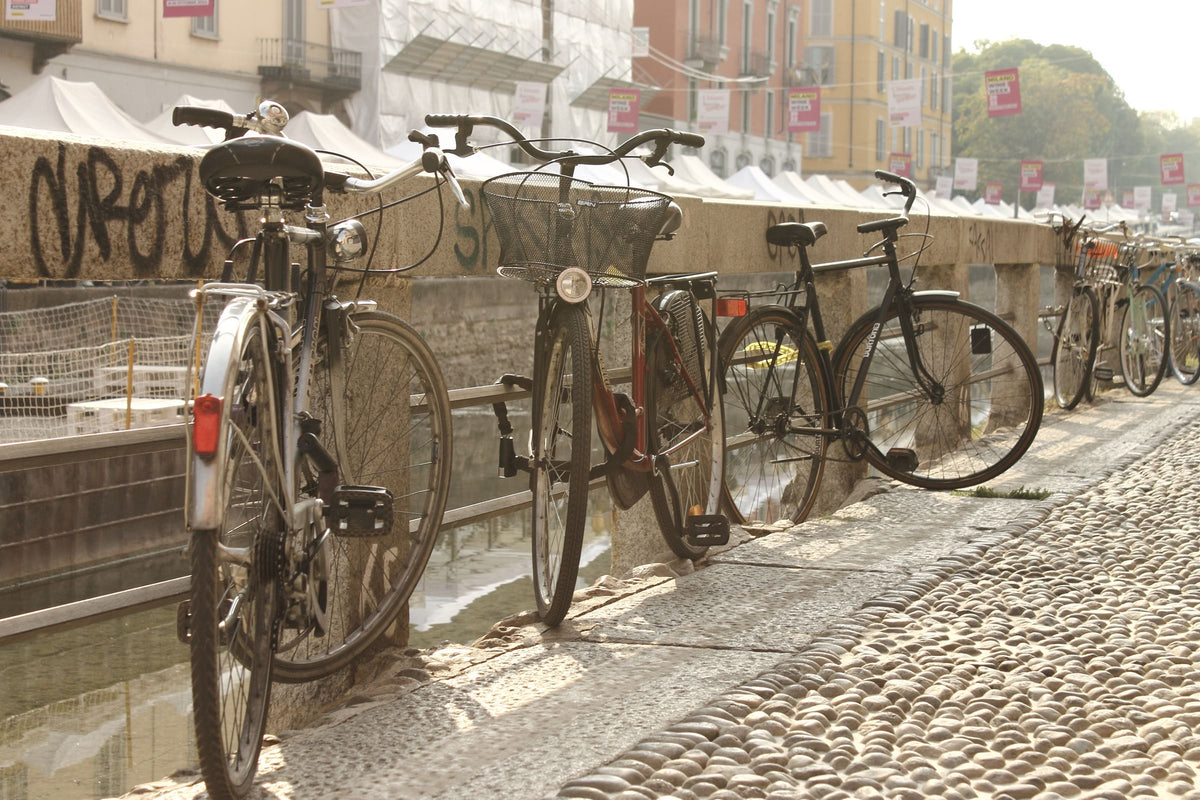 Vintage bicycles lined up along the Naviglio Grande