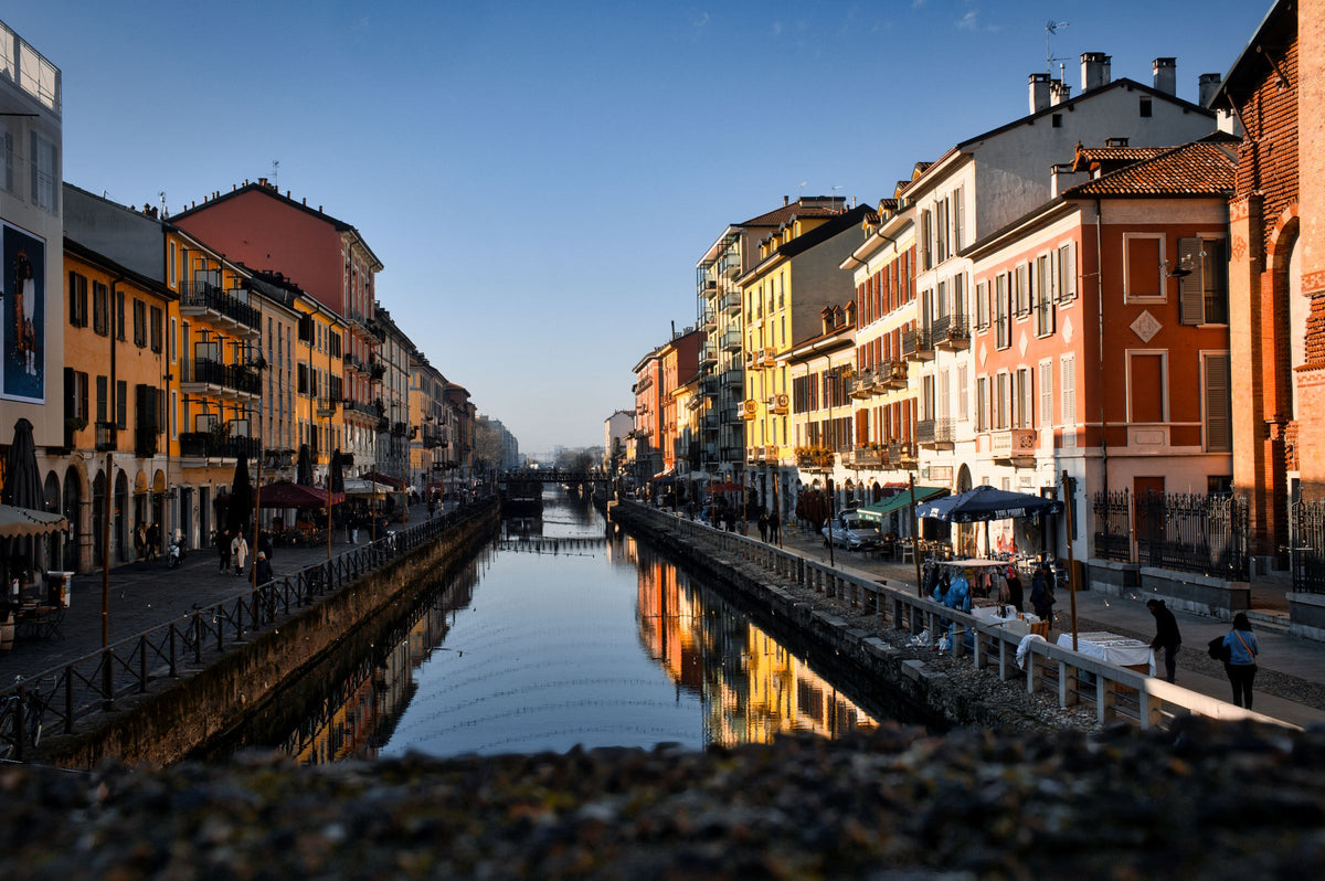 Outdoor cafés along a canal in the Navigli district